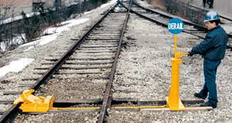 More convenient than a hinged derail. Derail shoe slides in and out of housing through the leverage of a waist-high operating lever. No need to bend or stoop to activate or deactivate the derail. Work from a comfortable standing position alongside the track.